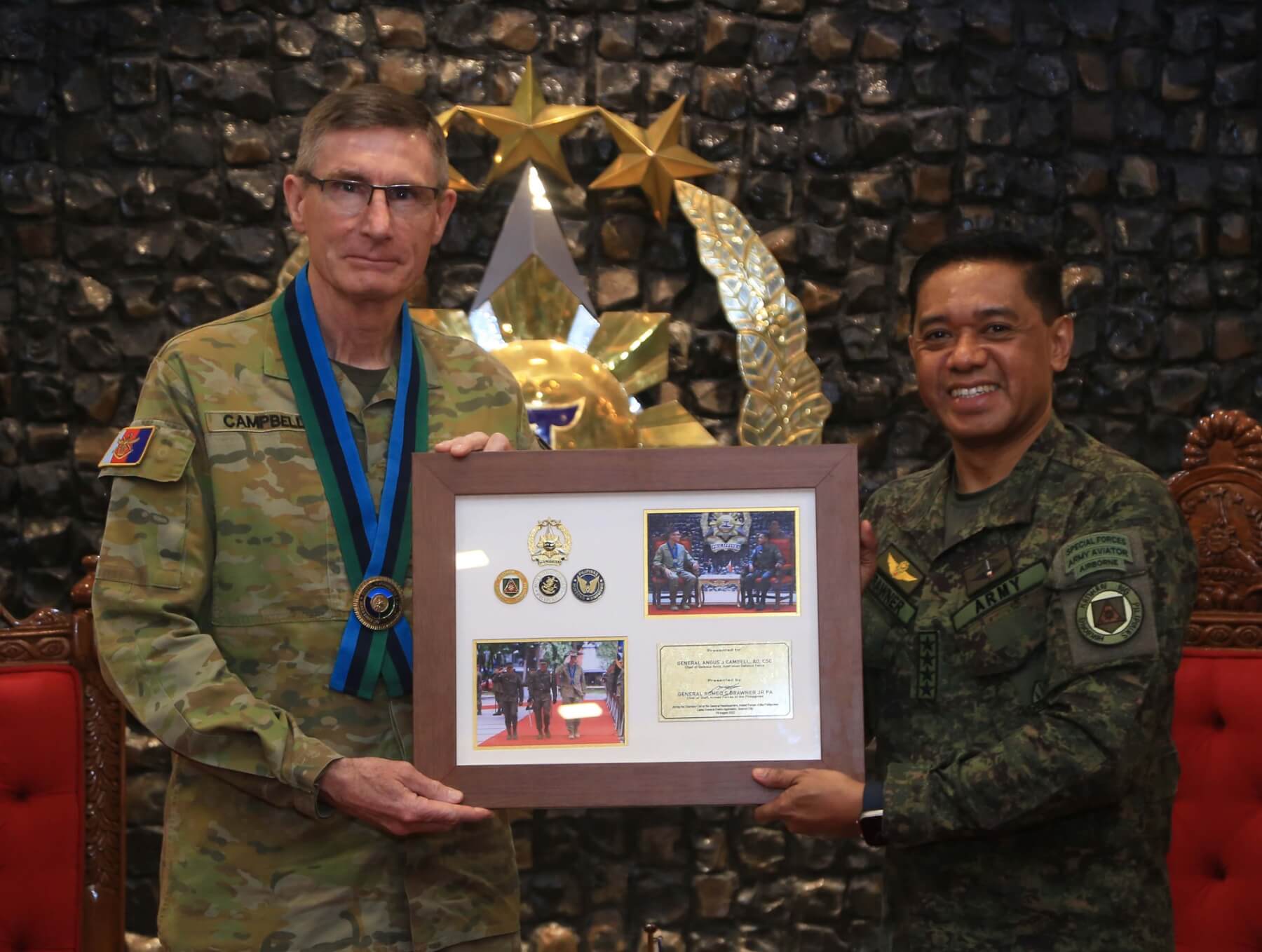 Gen. Romeo Brawner Jr hands over a token to Gen. Angus Campbell during a Courtesy Call at the General Headquarters on August 29.